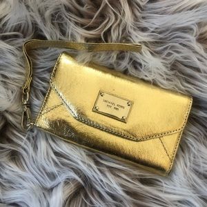 Metallic gold Michael Kors wristlet